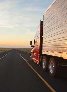 side of semi truck on empty highway - excess liability insurance